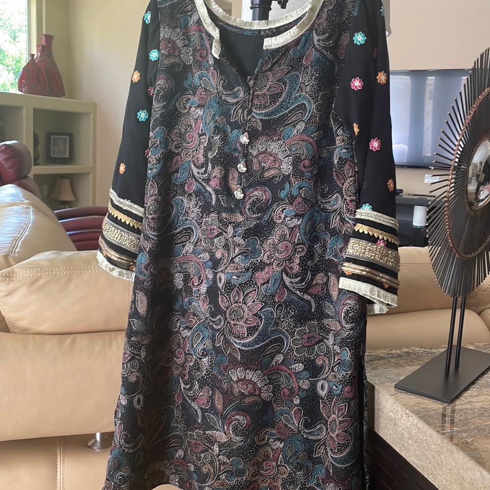 Band new Printed silk kurta with lace and embroidery on sleeves.